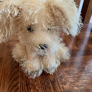 fluffy beige dog stuffed animal